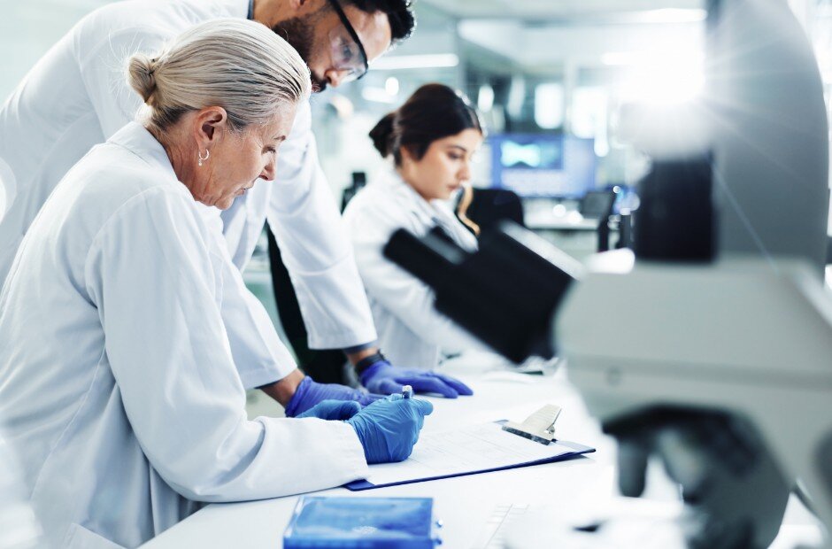 Group of research scientists smiling in a lab